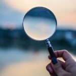 selective focus photo of magnifying glass