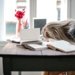 woman leaning on table